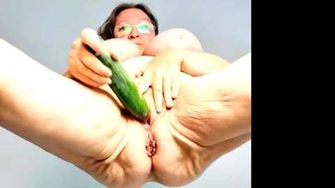 Horny granny masturbate by cucumber
